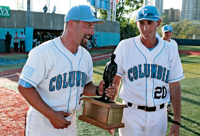 Boretti, with trophy, and assistant coach Dan Tischler leave Robertston Field at Satow Stadium after the Lions swept a doubleheader against Dartmouth on May 4 to win the 2013 Ivy League Championship.PHOTO: MIKE McLAUGHLIN